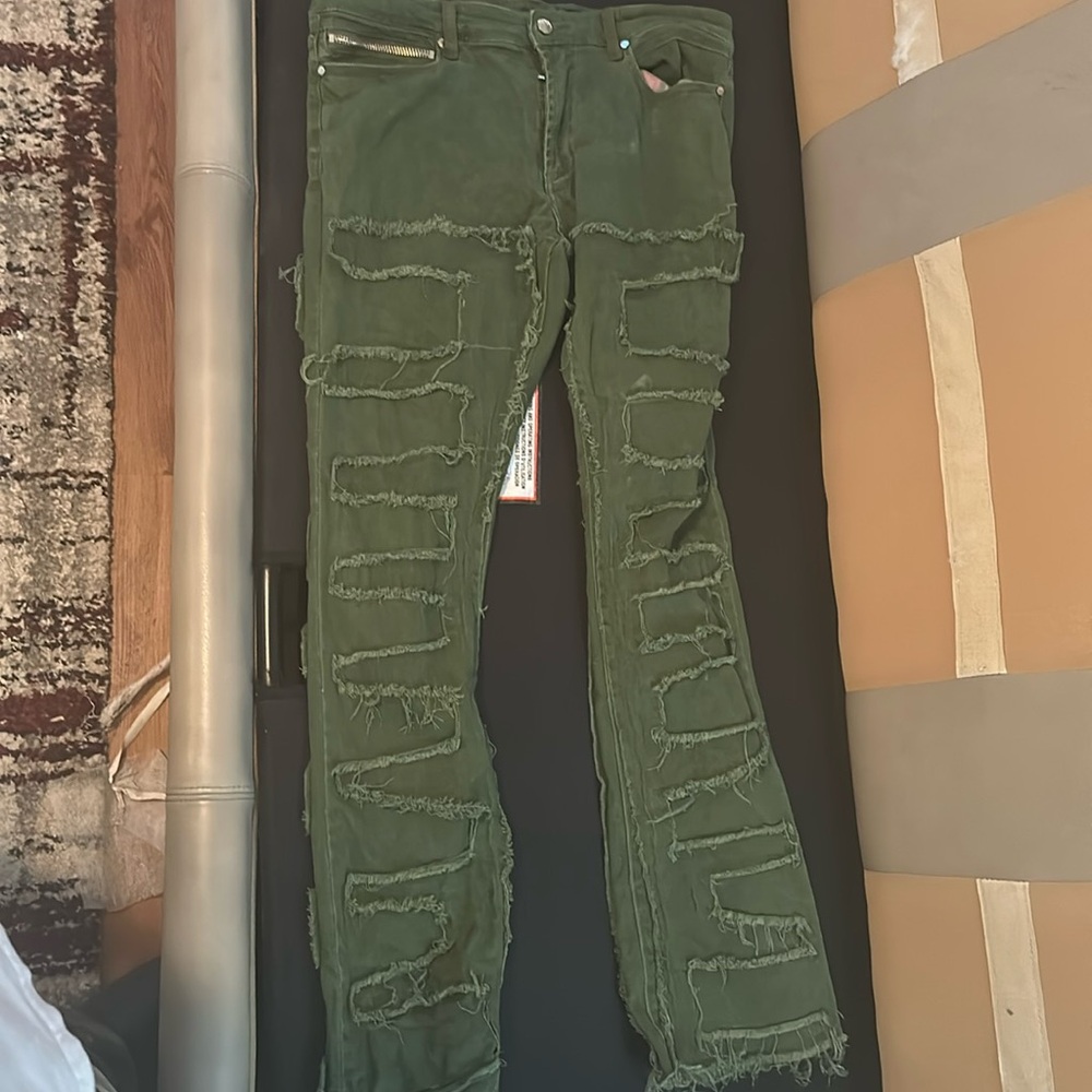 Green stacked jeans